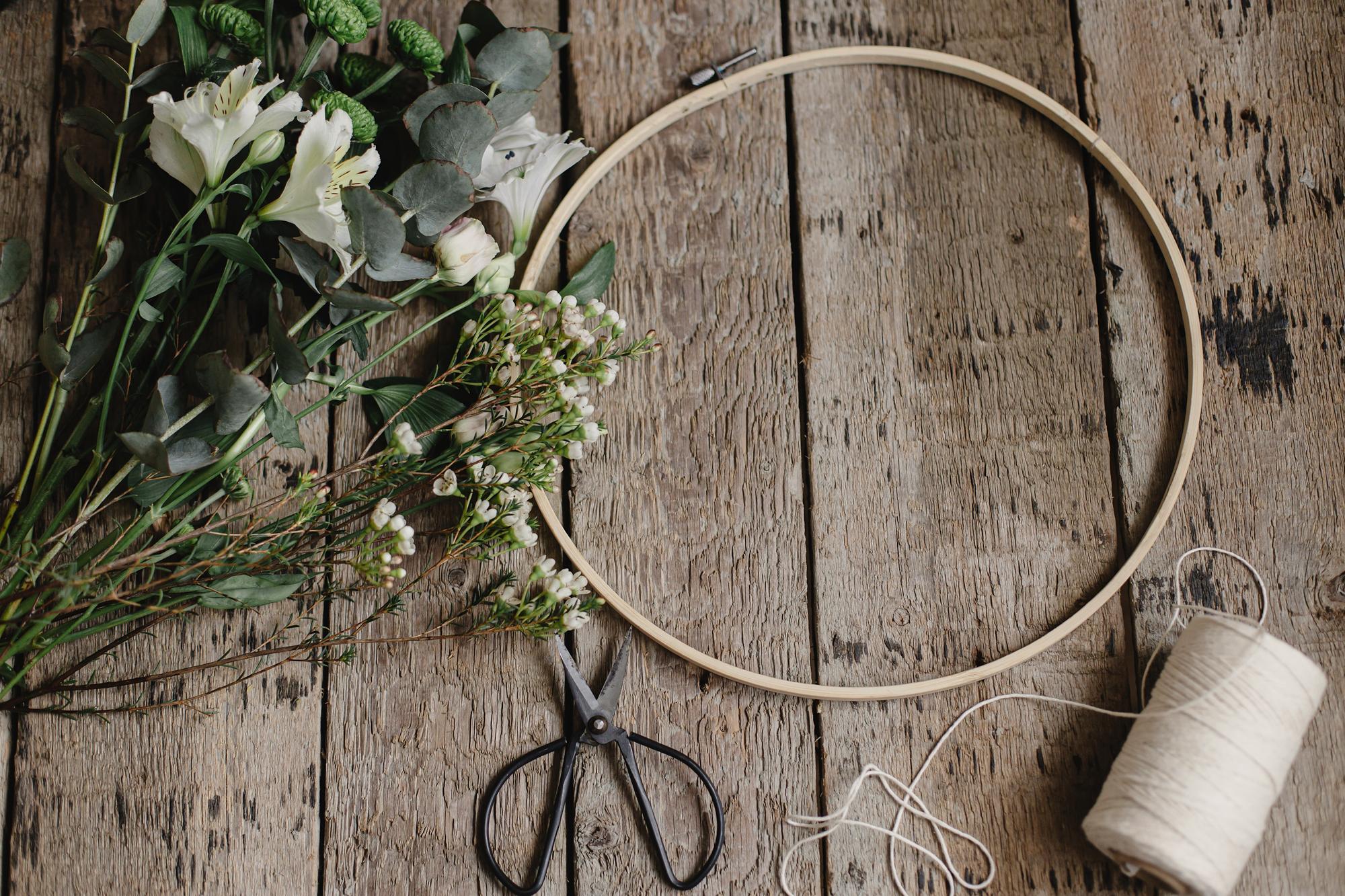 studio window with hoop and threads on table
