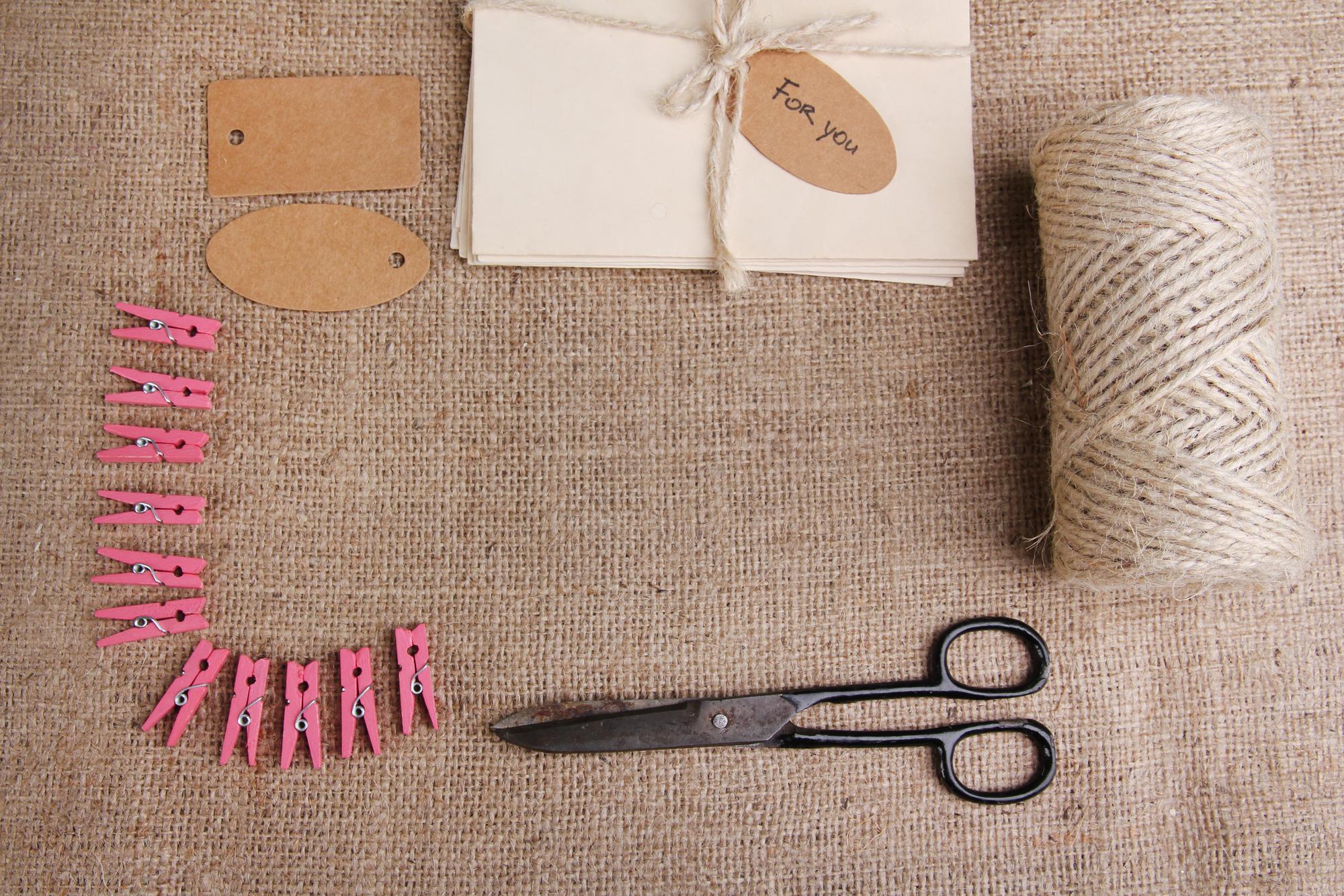 flat-lay of kit contents: linen, threads, and pattern card
